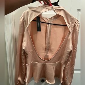 LuLu’s open back silk blouse
